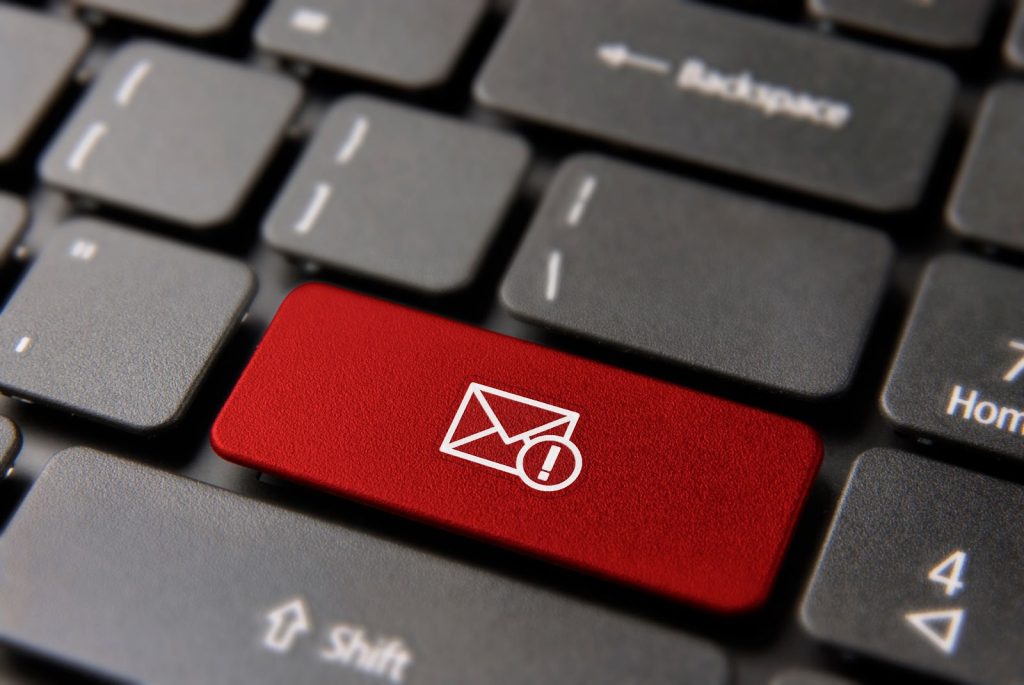 A red keyboard button featuring an email icon,symbolizing email campaigns and enhancing conversion rates in Klaviyo.