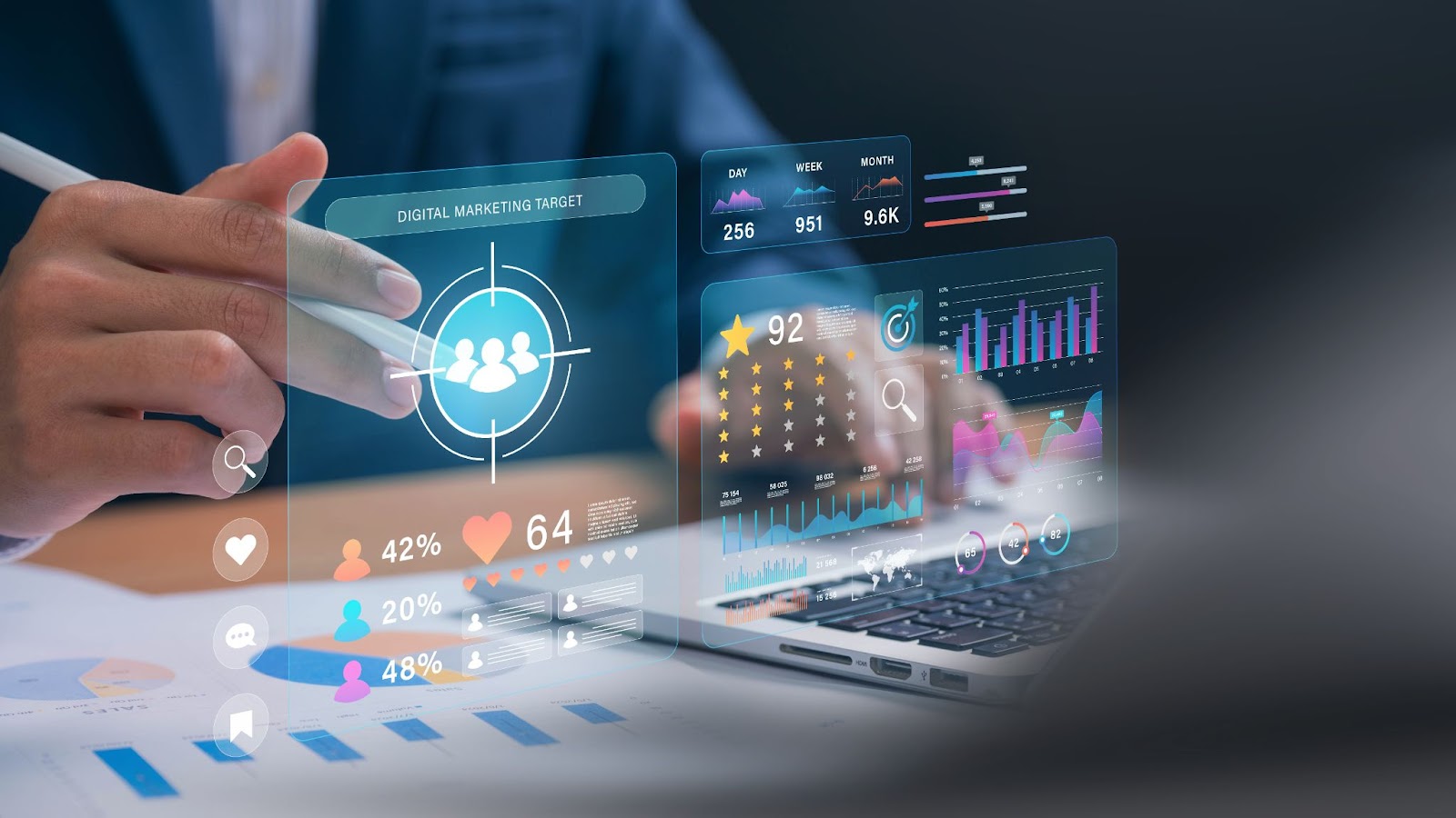 Hand interacting with holographic digital marketing target and analytics dashboard on a laptop.
