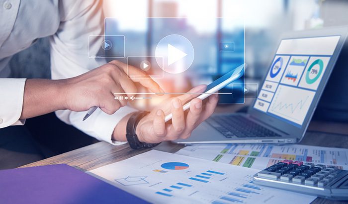 A Man Watching Video On Tablet For Content Marketing Service, content Repurposing, blog Posts