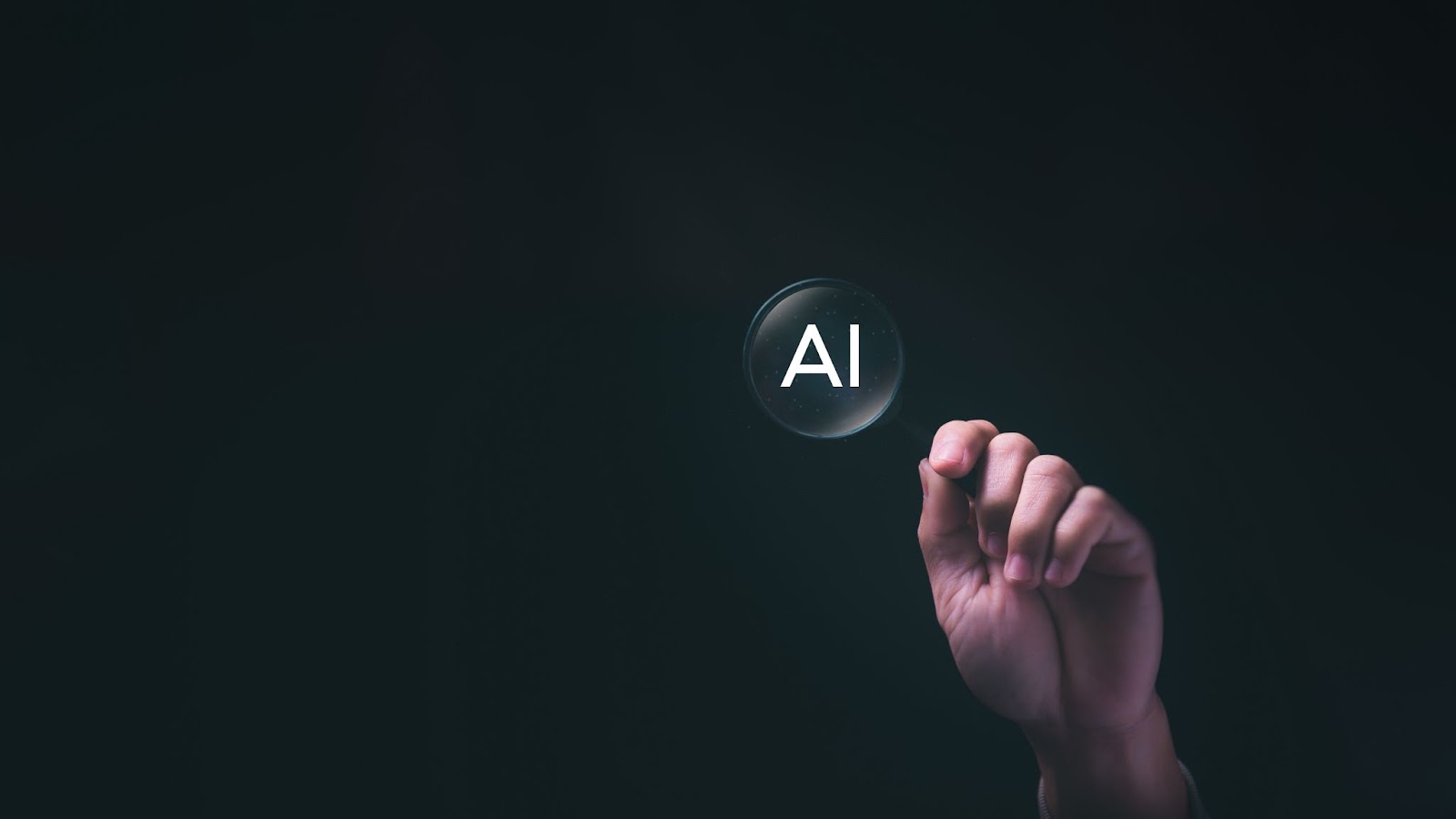 Hand holding a magnifying glass over the letters AI against a dark background.
